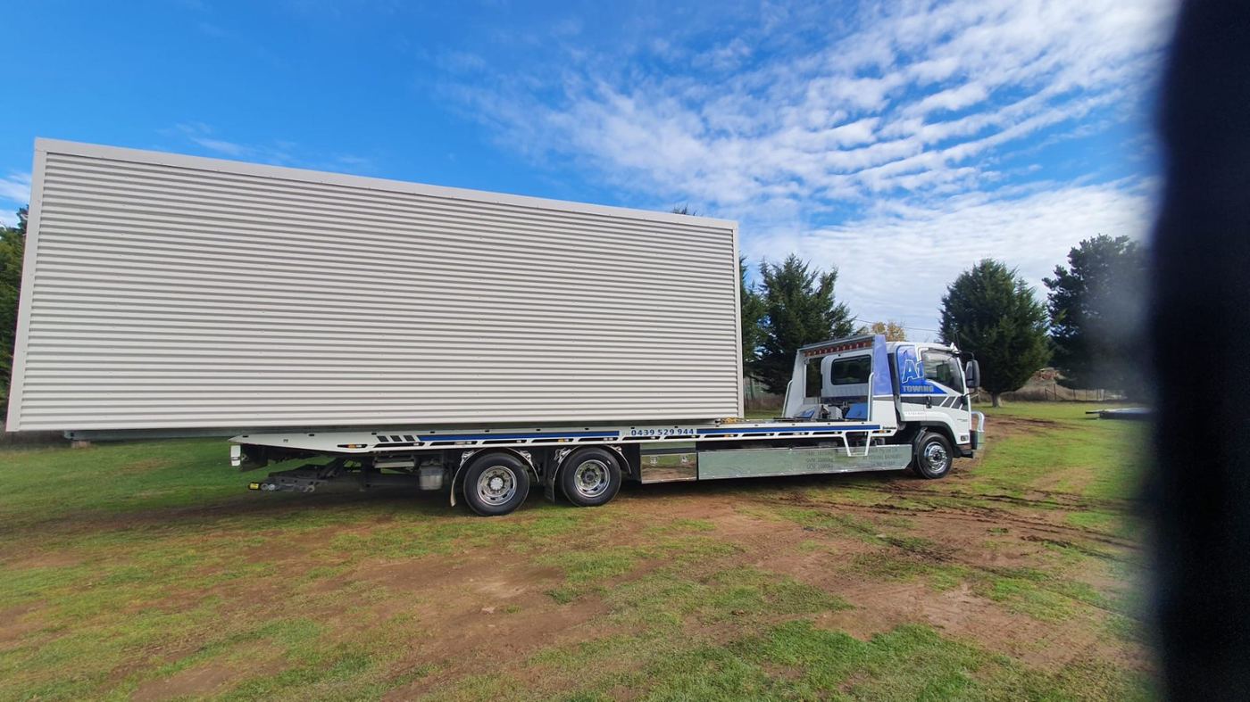 On the truck · tilt-tray delivery